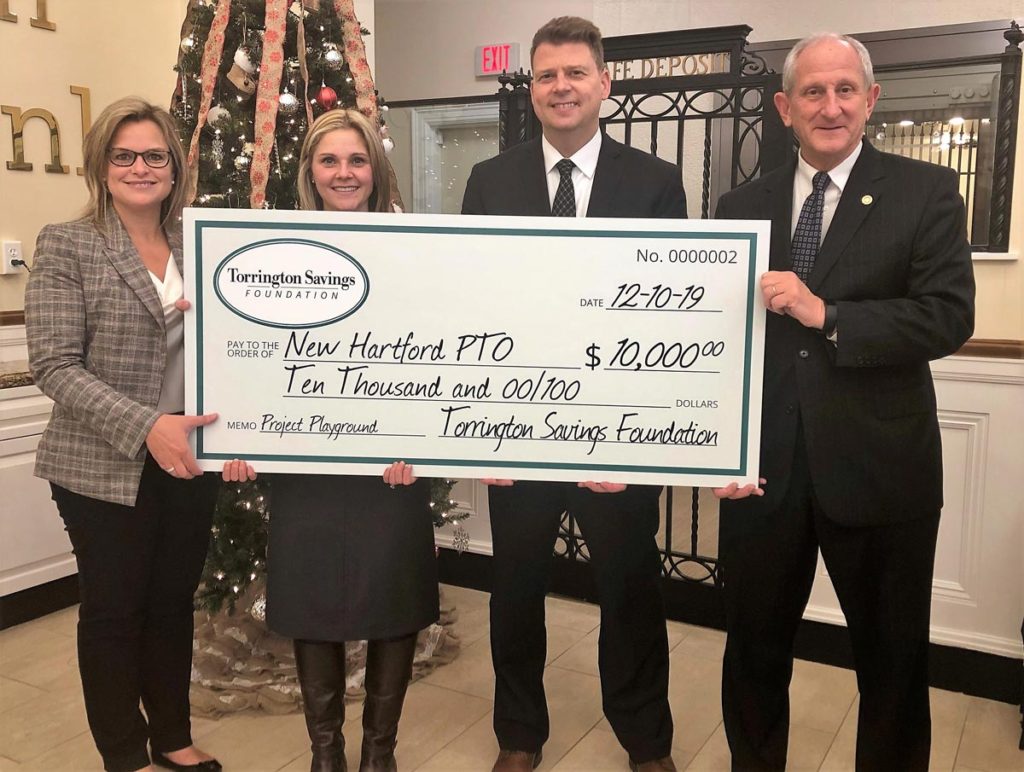 John E. Janco, Foundation Co-Chairman presents check to Christina Emery, Prime Time House Executive Director and clients.